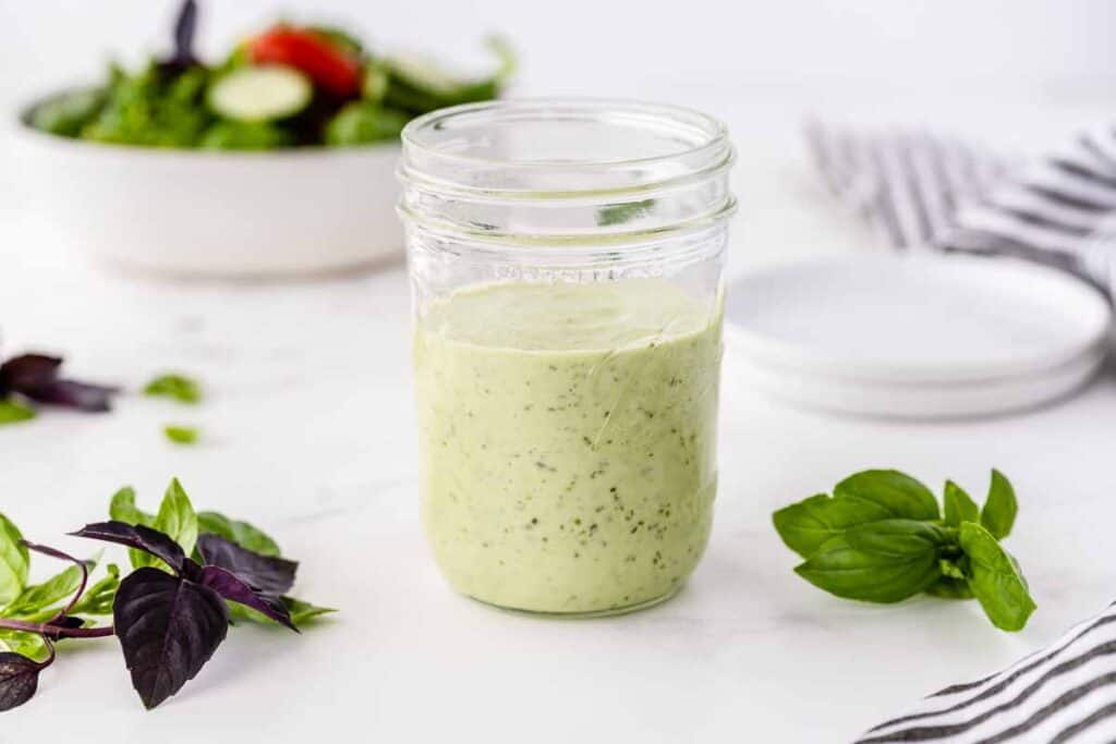 Buttermilk basil salad dressing in a mason jar.