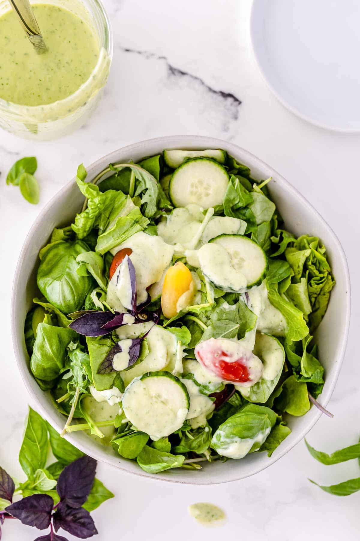 A green salad dressed with Basil Buttermilk Dressing.