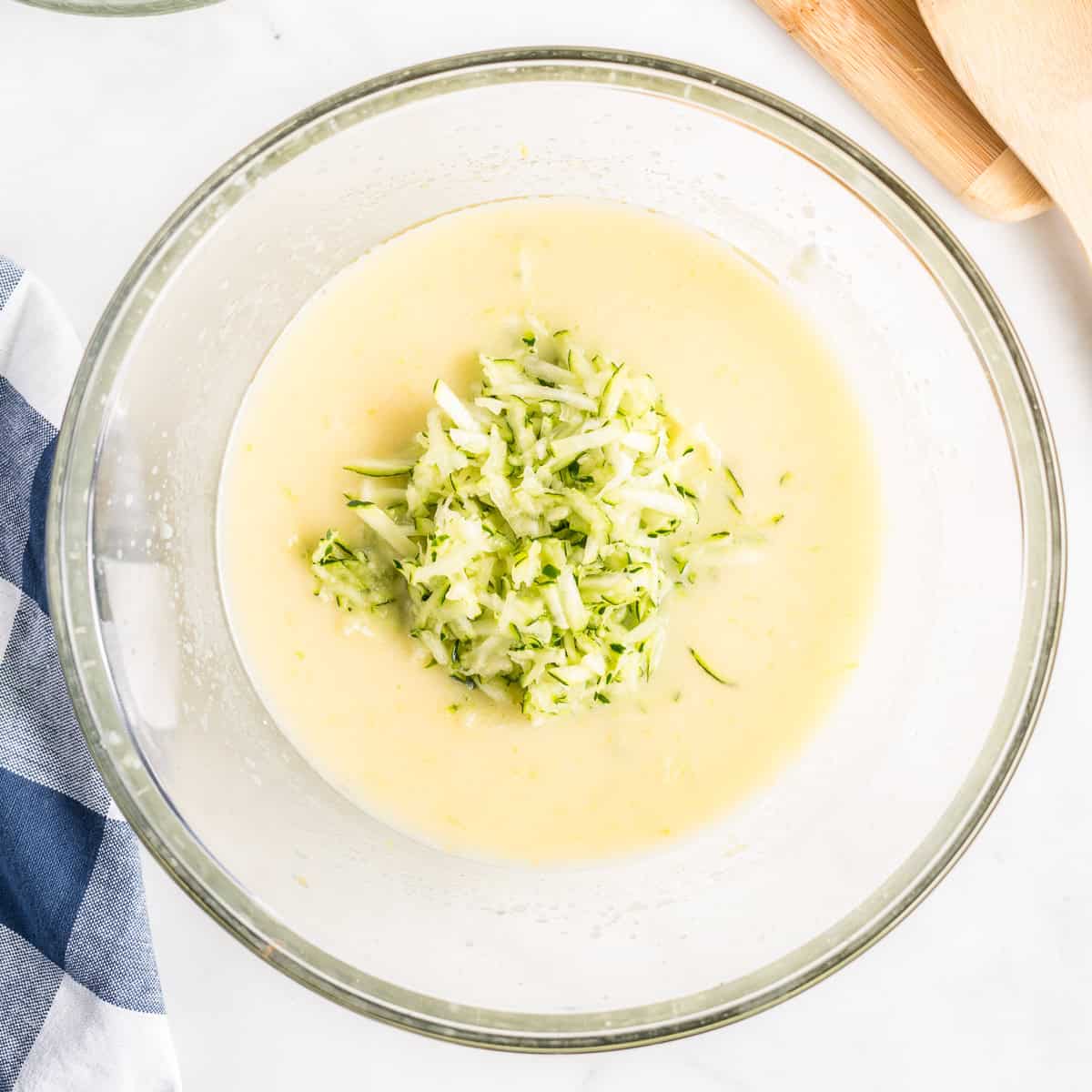 Shredded zucchini added to the lemon coffee cake batter.