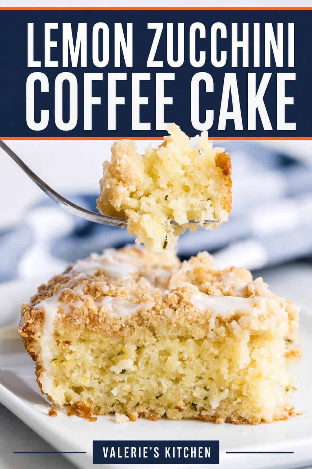Slice of Lemon Zucchini Coffee Cake with crumb topping and lemon glaze. A fork holds a bite above the cake. The image includes the title "Lemon Zucchini Coffee Cake."