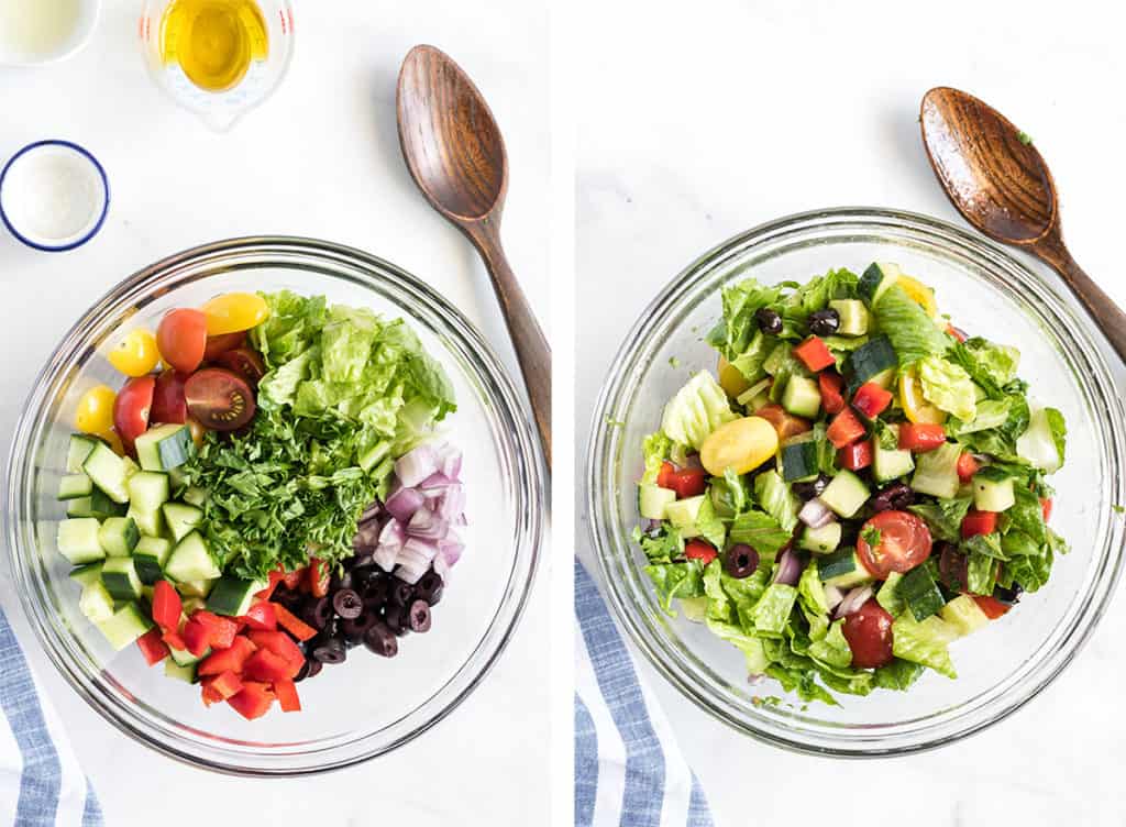Tomatoes, cucumber, bell pepper, kalamata olives and lettuce are combined in a glass bowl.