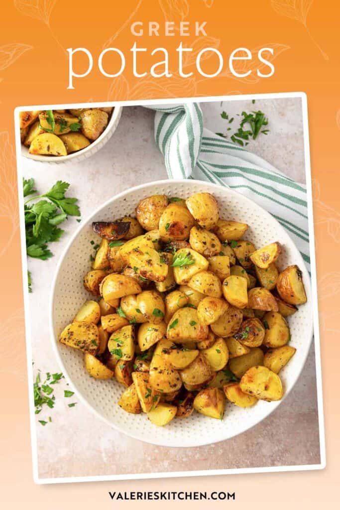 Greek potatoes in a white serving bowl with text overlay.