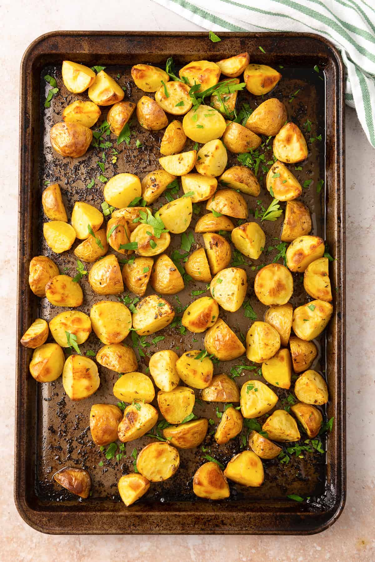 Lemon Roasted Greek Potatoes on a baking sheet shot from over the top.