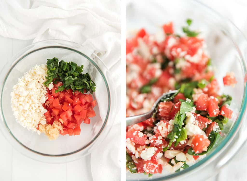 Tomatoes,feta, basil, and garlic in a glass mixing bowl.