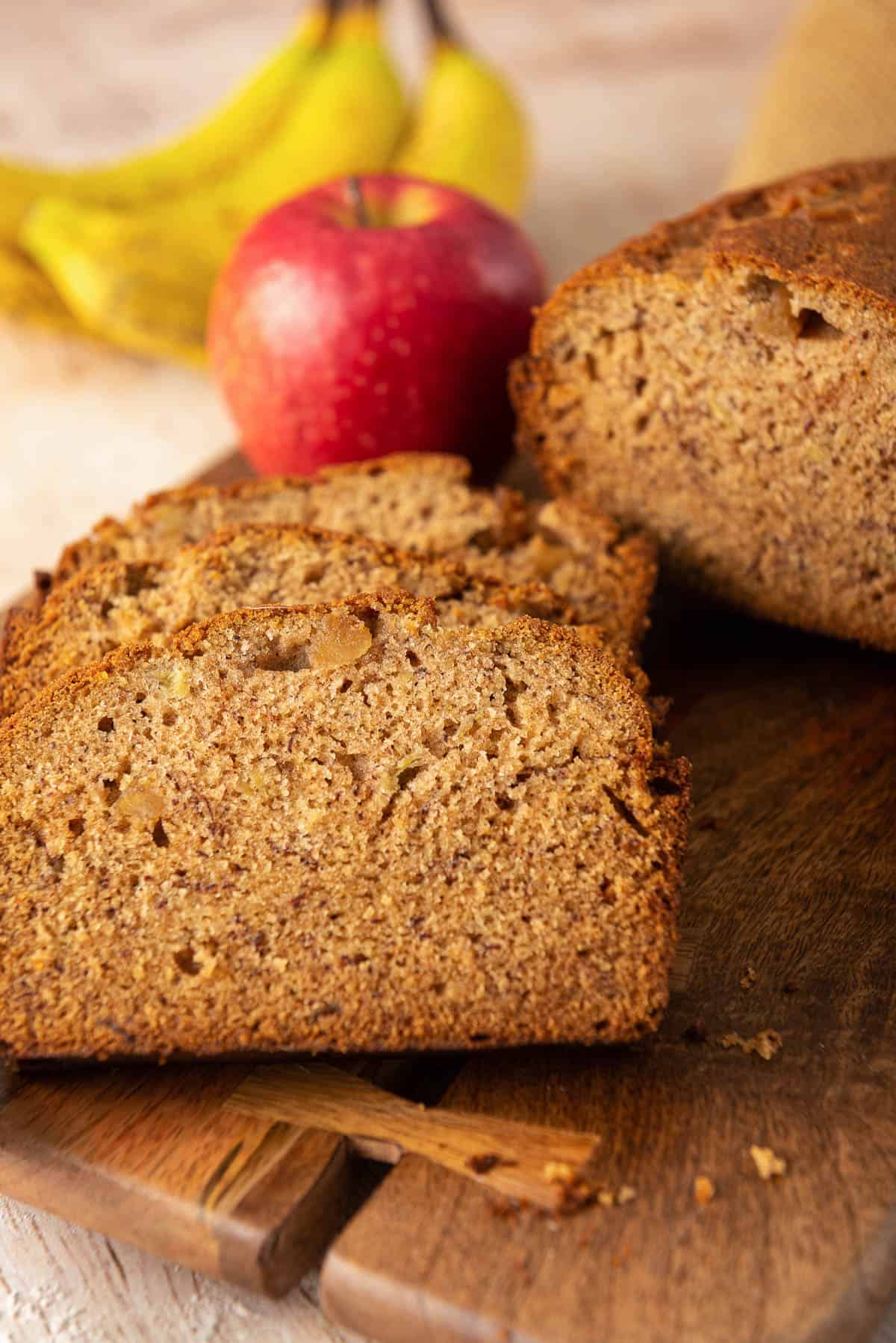 Slices of Apple Banana Bread on a cutting board.