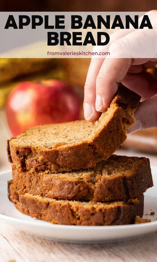 A hand lifts a slice of Apple Banana Bread with text overlay.