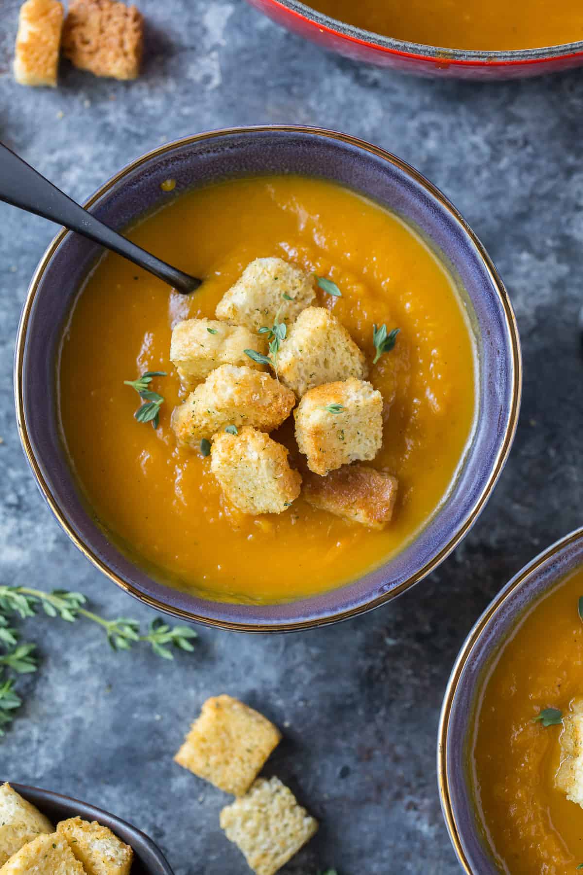 Butternut Squash Soup in a bowl topped with croutons.