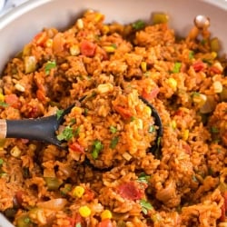 A skillet filled with Spanish Rice with Ground Beef.