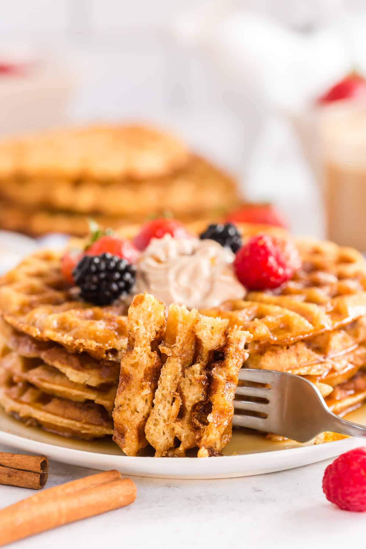 Pieces of waffle on a fork.