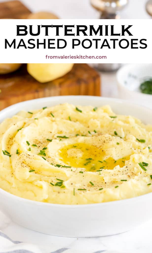 A close up of mashed potatoes topped with chives in a white bowl with text overlay.