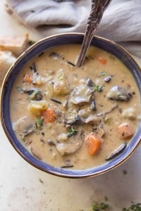 A close up image of a bowl of mushroom wild rice soup.