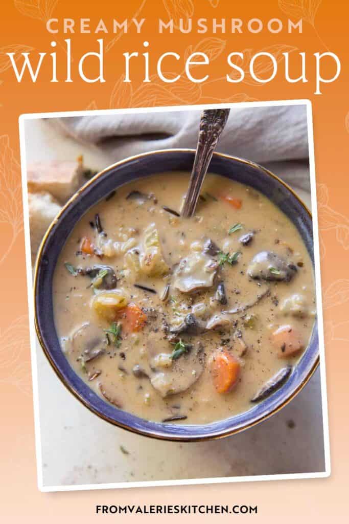 A bowl of creamy mushroom wild rice soup with text overlay.