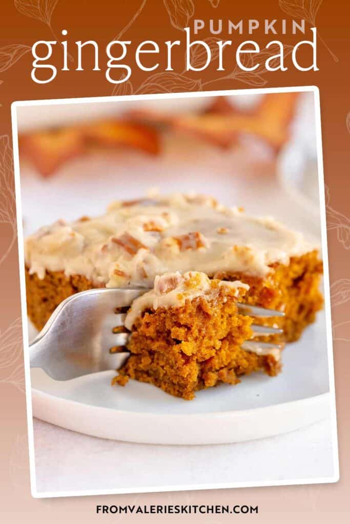 A fork pressing into a slice of pumpkin gingerbread on a plate with text overlay.