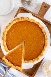 A spatula lifts a slice of pie.