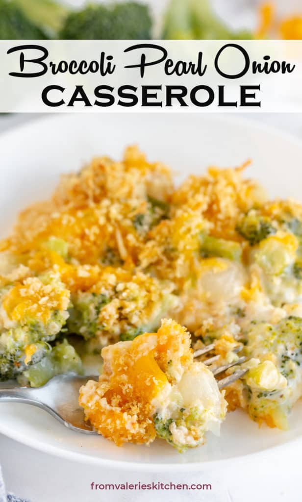 A fork loaded with broccoli pearl onion casserole resting on a plate with text overlay.