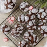 Chocolate Peppermint Crinkles on a wire rack with peppermint candies.