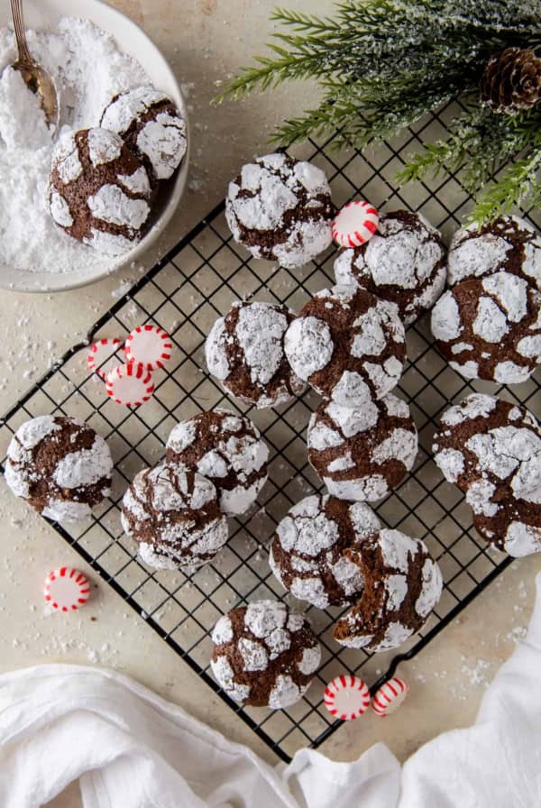 Chocolate Peppermint Crinkles on a wire rack with peppermint candies.