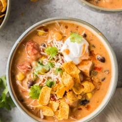 A bowl of creamy chicken soup shot from over the top.