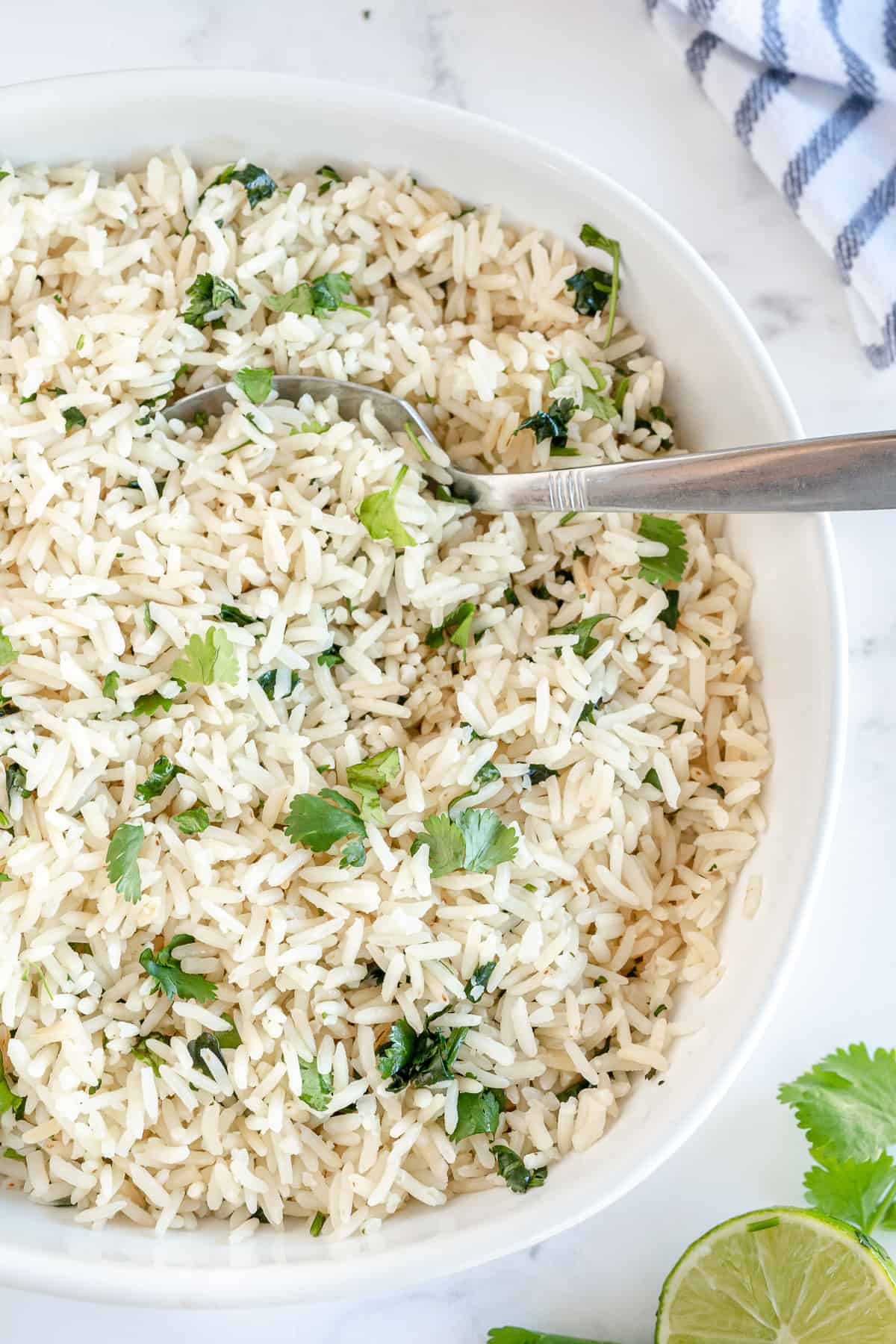 An over the top shot of a bowl of Cilantro Lime Rice with a spoon.