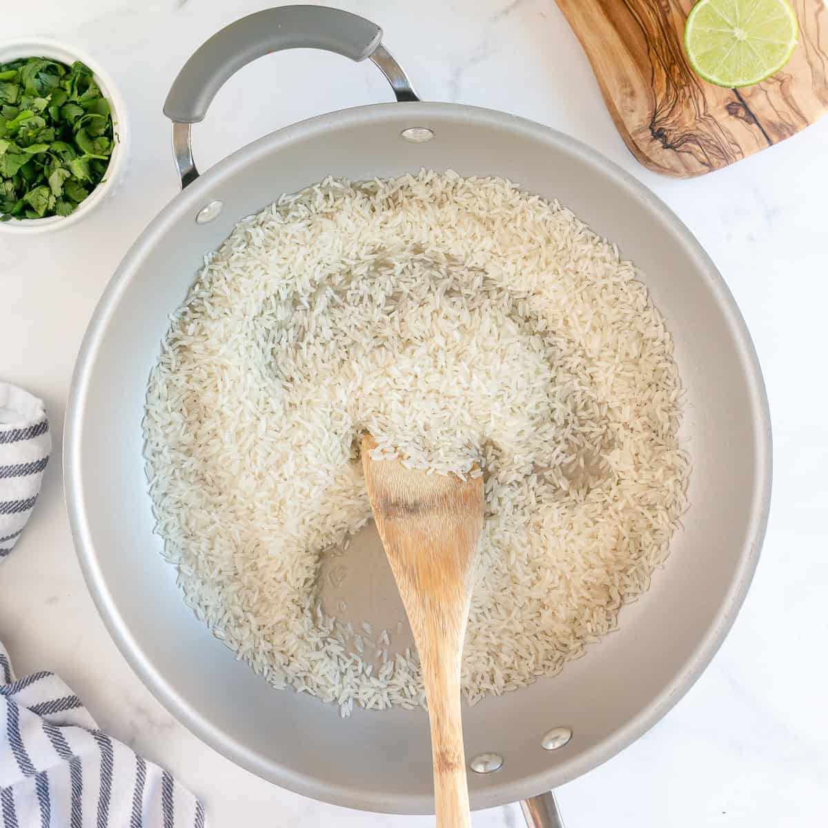 Toasting long grain rice in oil before adding the broth for cilantro lime rice.