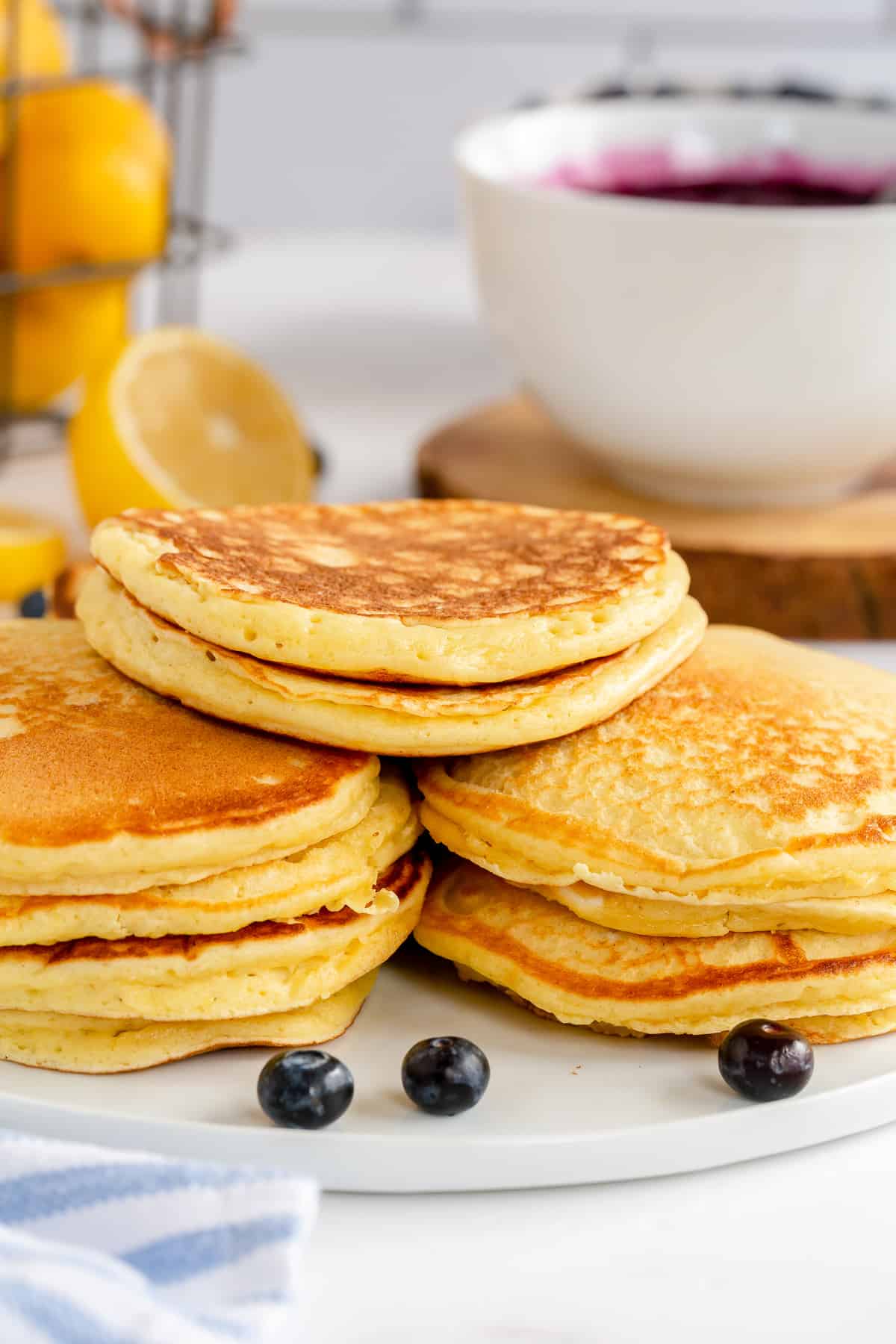 A close up of stacks of Lemon Ricotta Pancakes on a platter.