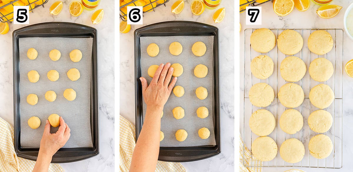 A hand flattens balls of cookie dough on a baking sheet.