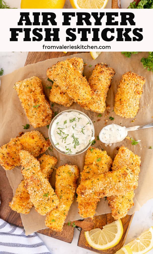 A pile of Air Fryer Fish Sticks and tartar sauce on a board with text overlay.