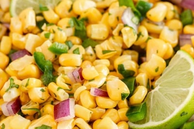 A closeup of a bowl of corn salsa.