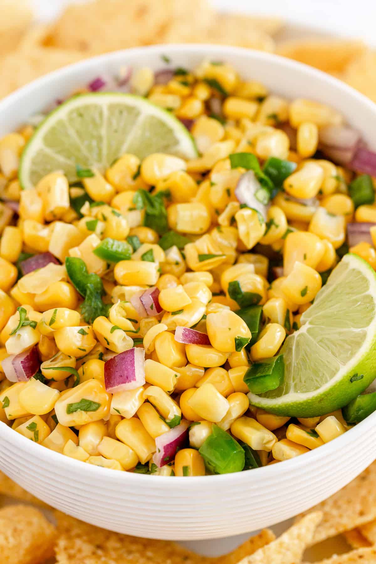 A closeup of a bowl of corn salsa.