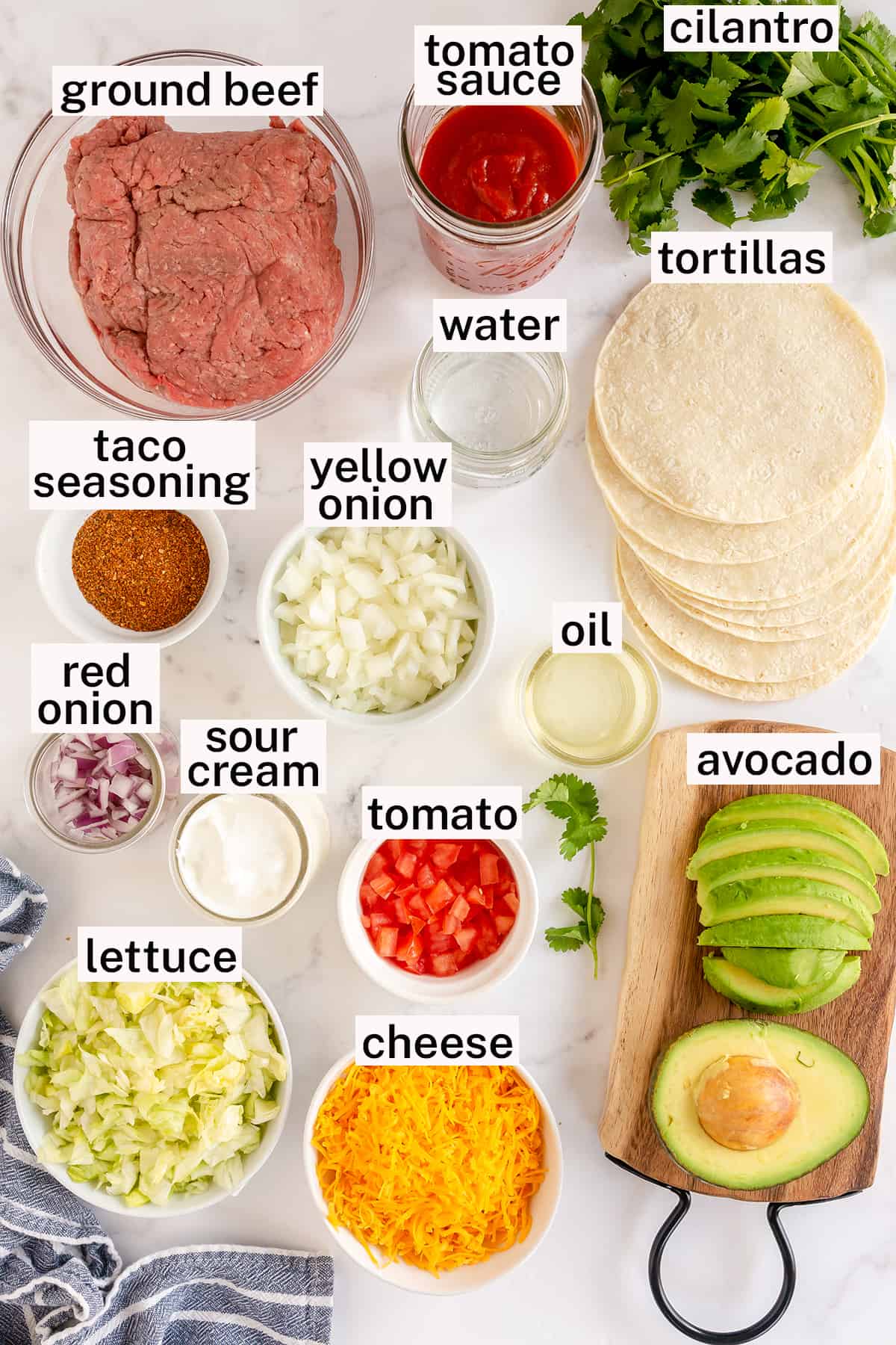 Ingredients and toppings for Ground Beef Tacos.