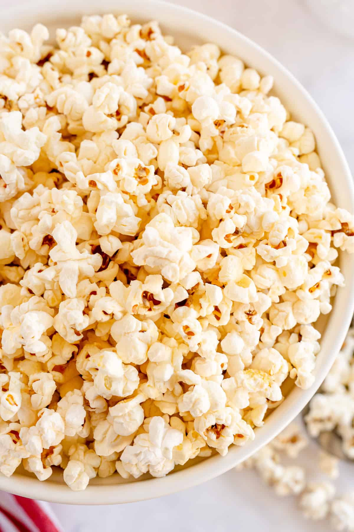 A close up of large bowl of popcorn shot from over the top.