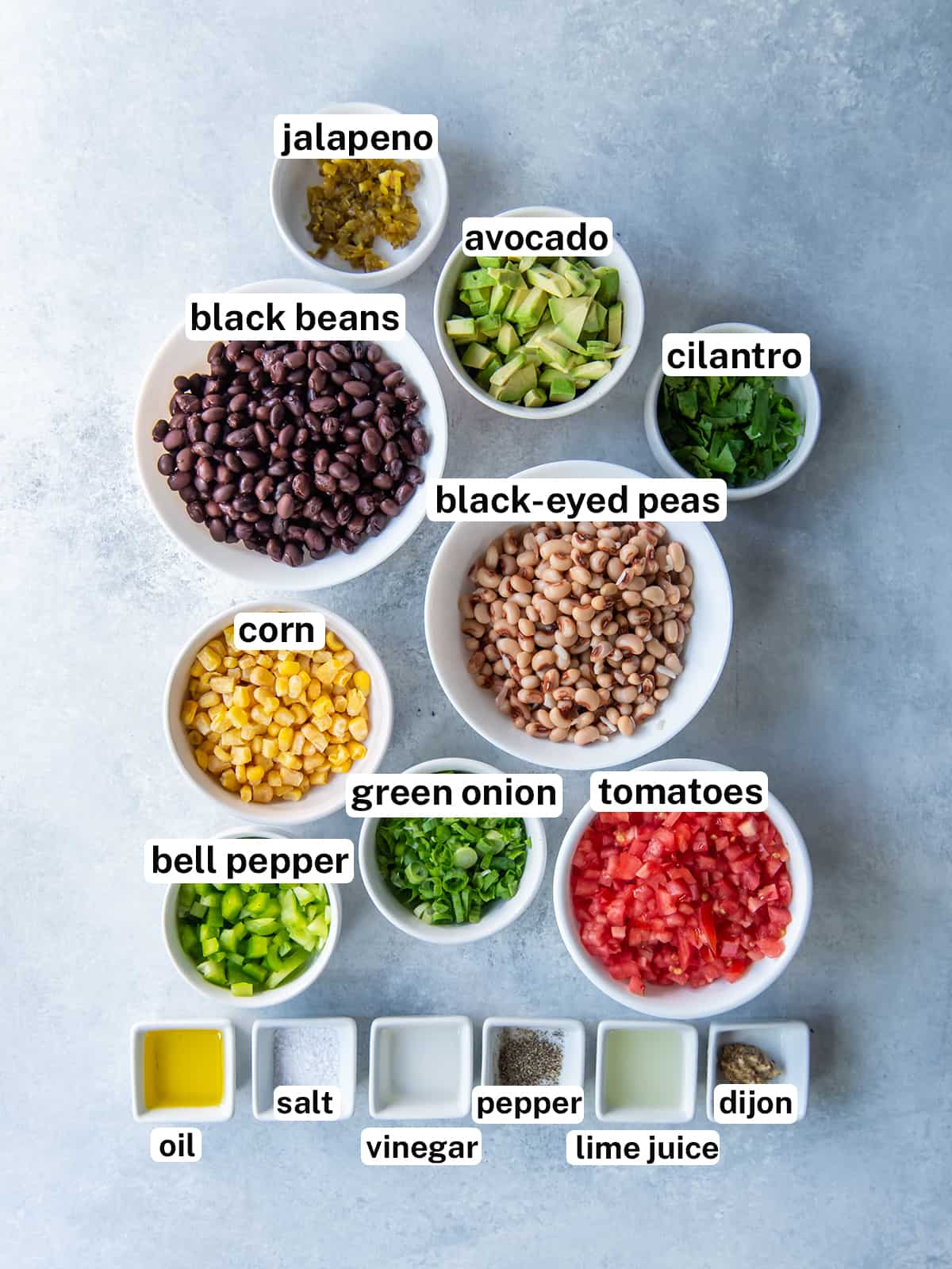 The ingredients to make Cowboy Caviar with overlay text.