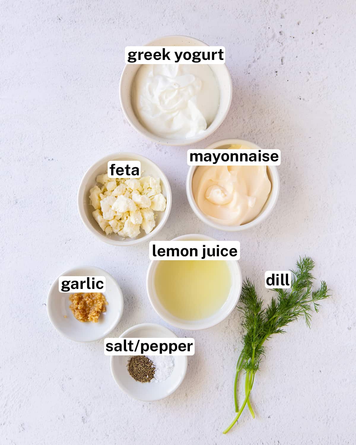 Ingredients including Greek yogurt, mayonnaise, feta and lemon juice with text overlay.