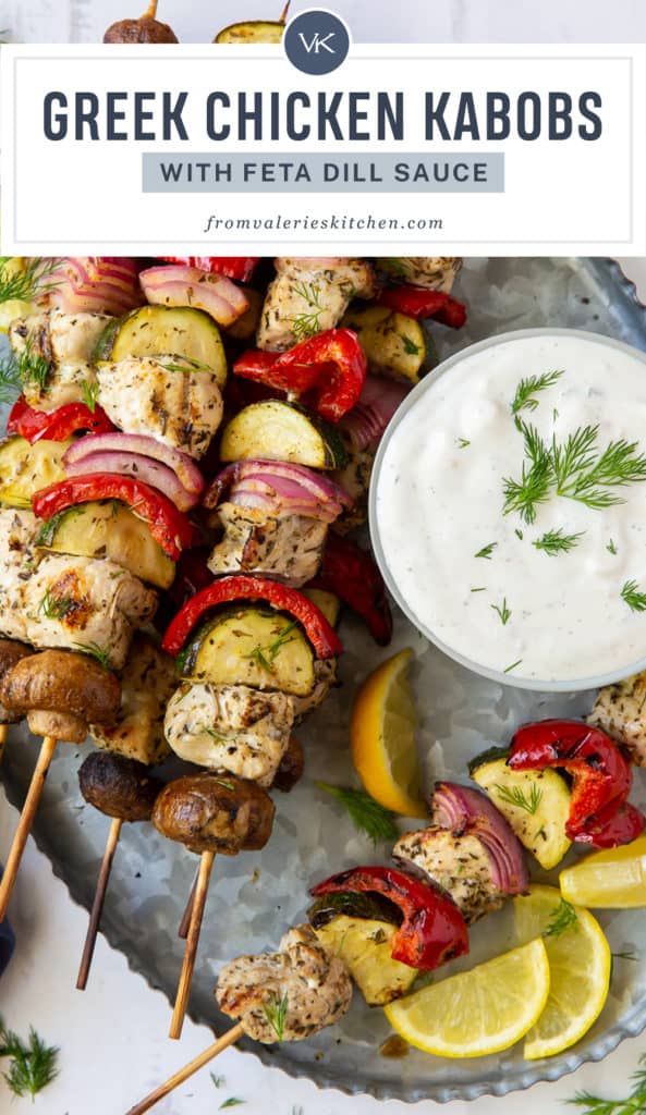 Greek Chicken Kabobs on a silver platter with Feta Dill Sauce with text overlay.