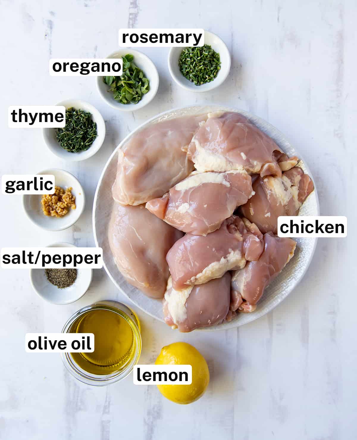 The ingredients for making Grilled Greek Chicken with overlay text.