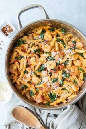 Shrimp and Spinach Pasta in a skillet shot from over the top.