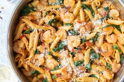 Shrimp and Spinach Pasta in a skillet shot from over the top.