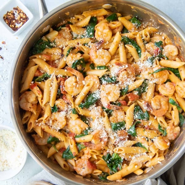 Shrimp and Spinach Pasta in a skillet shot from over the top.