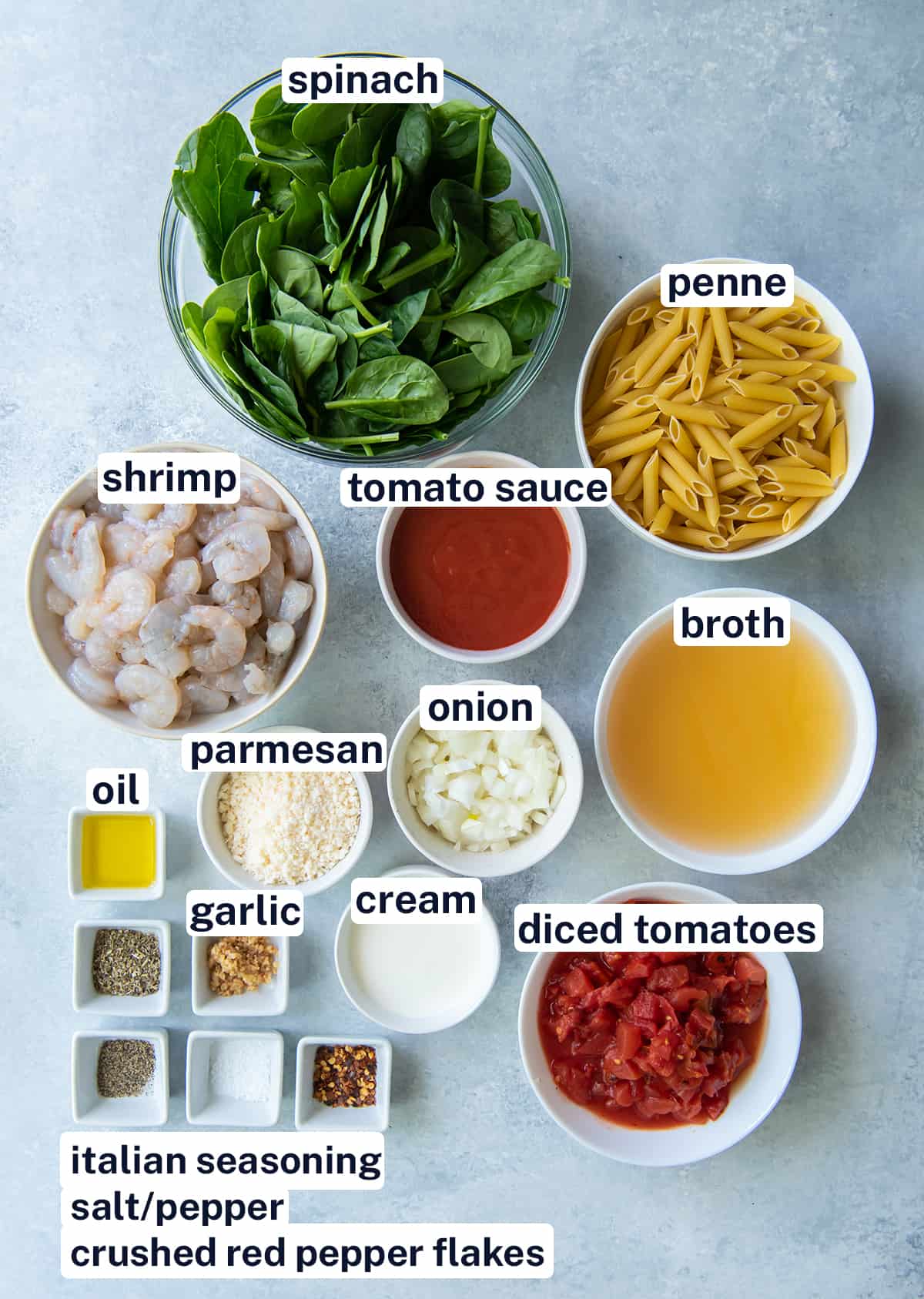 The ingredients for Shrimp and Spinach Pasta with overlay text.