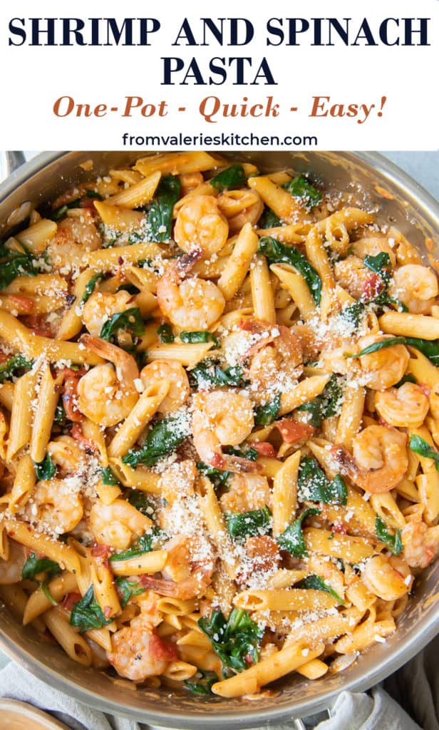 A skillet filled with pasta with shrimp and spinach with overlay text.