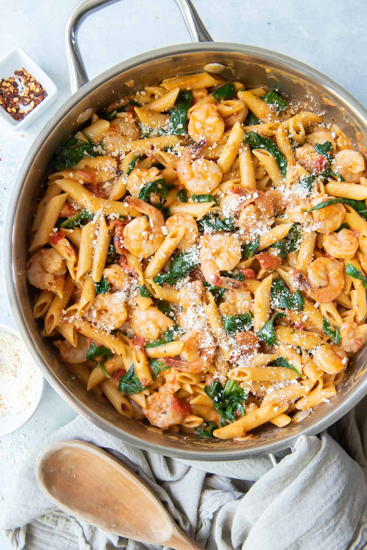 Shrimp and Spinach Pasta in a skillet shot from over the top.