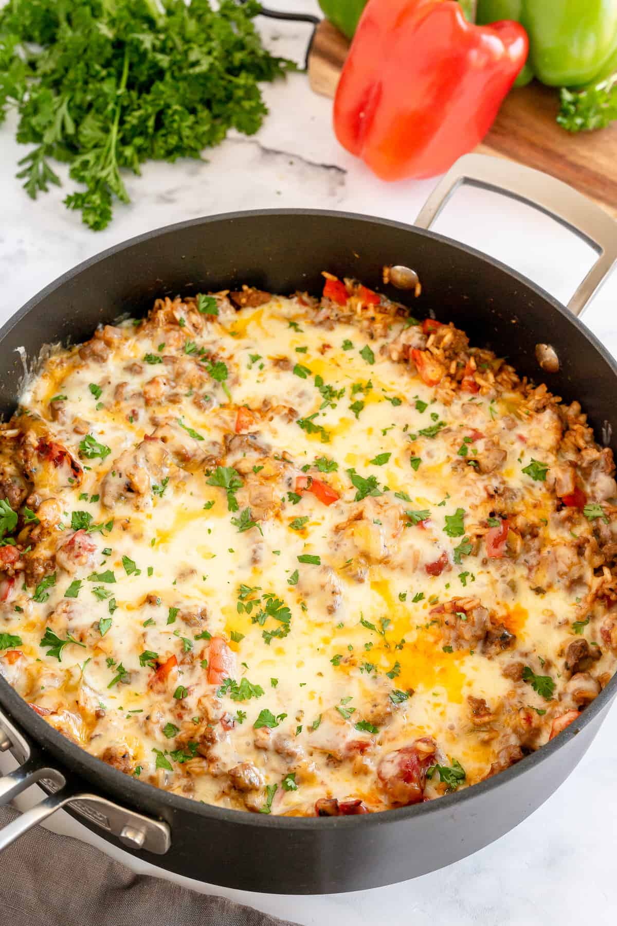 A skillet filled with stuffed pepper mixture.