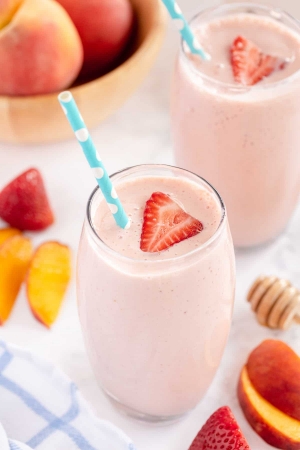 A top down shot of two Strawberry Peach Smoothies