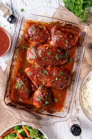 Oven BBQ Chicken in a baking dish on a cloth.