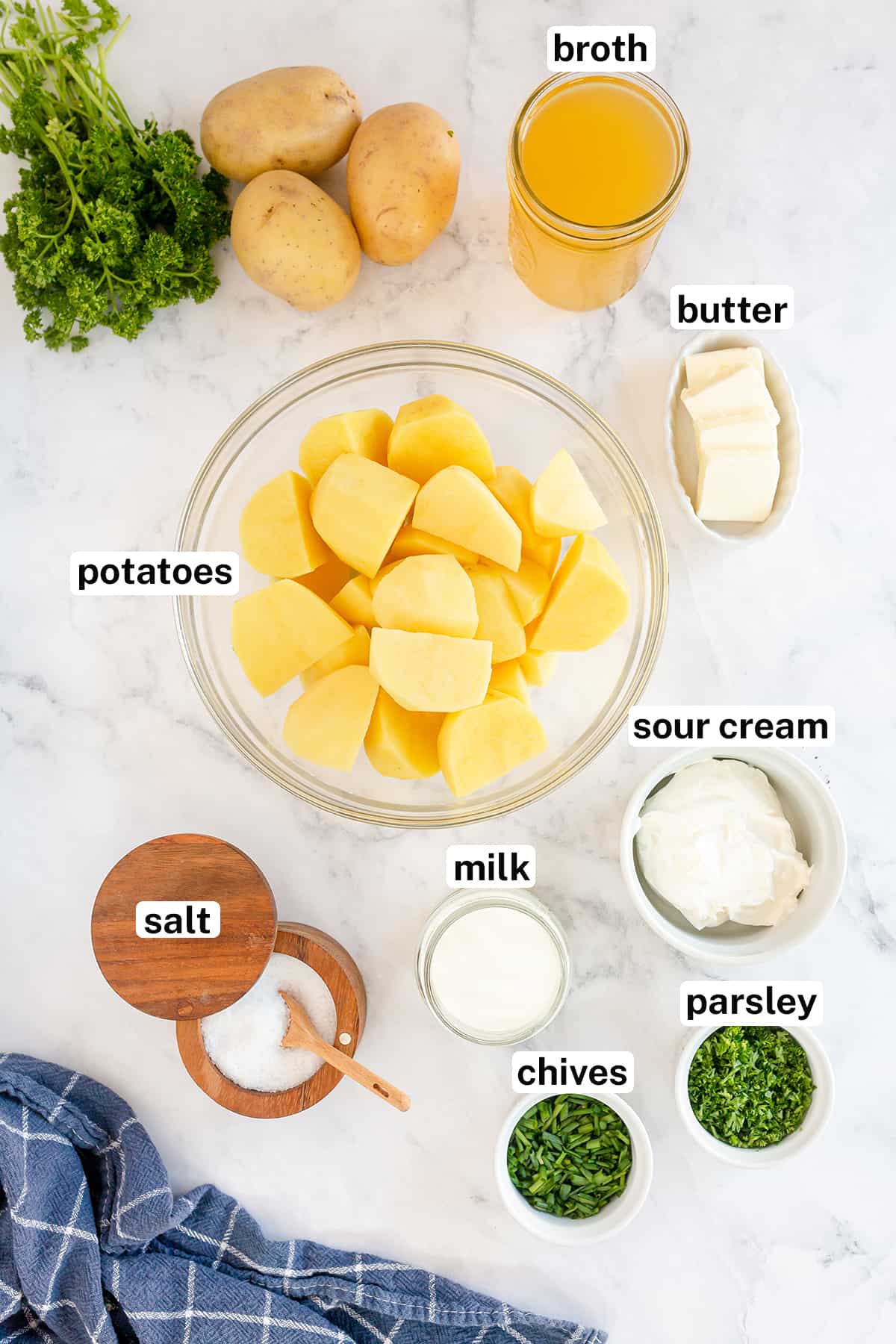 Gold potatoes, sour cream and other ingredients to make Sour Cream Mashed Potatoes.