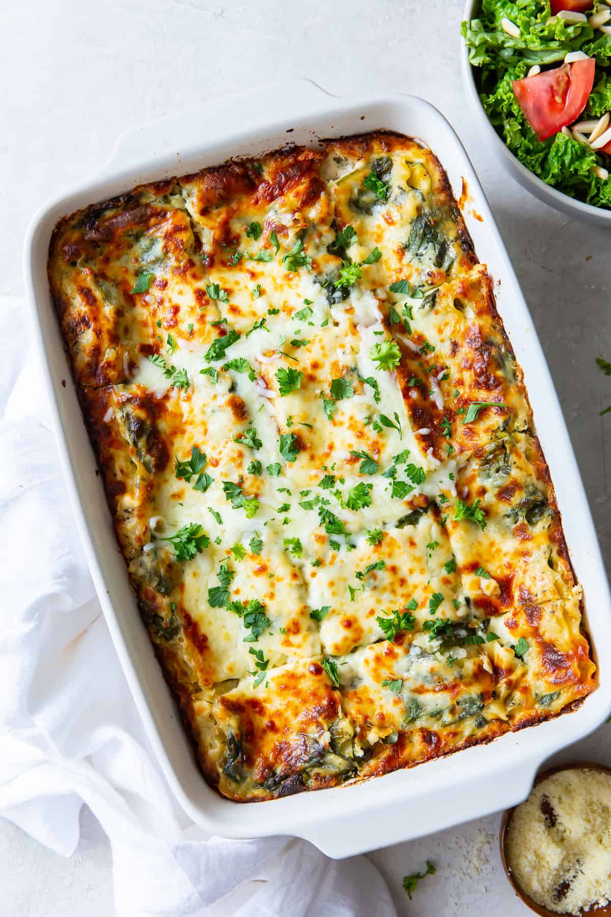 White Chicken Lasagna in a casserole dish shot from over the top.