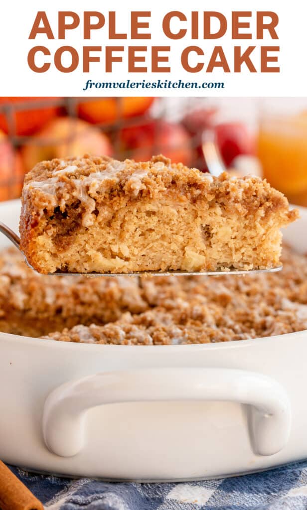 A slice of Apple Cider Coffee Cake is lifted from a baking dish with overlay text.