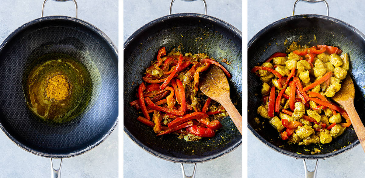 Curry, peppers, and chicken cooking in a skillet.