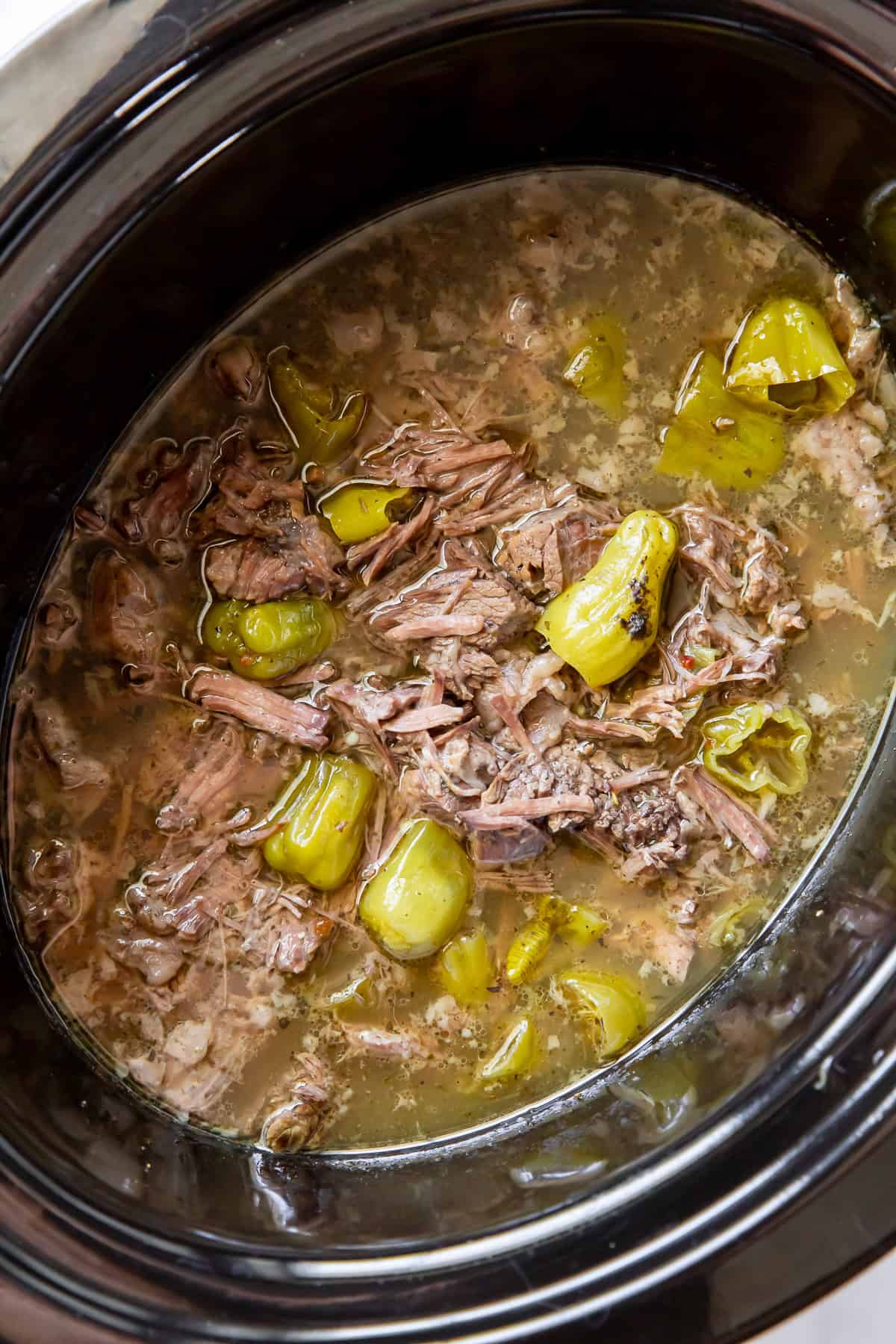 Shredded Italian beef for sandwiches in a slow cooker
