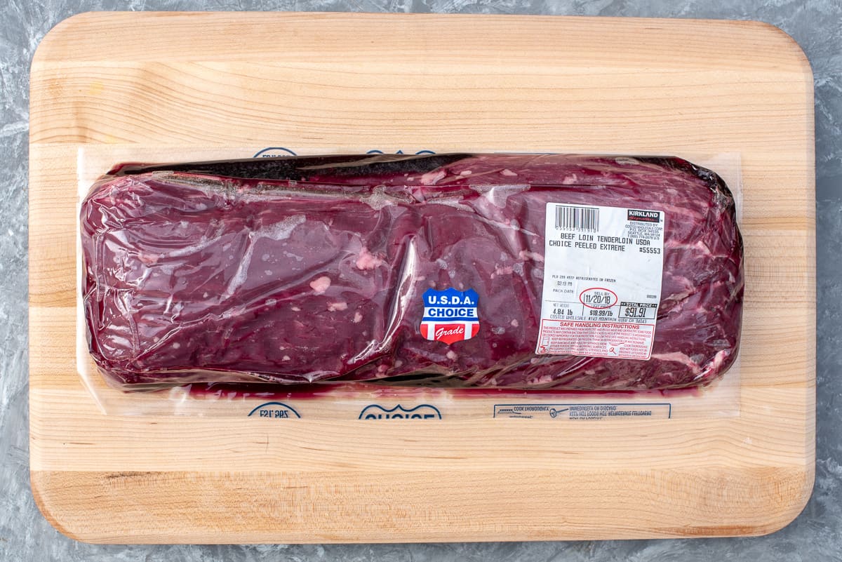 A whole beef tenderloin from Costco in the package.